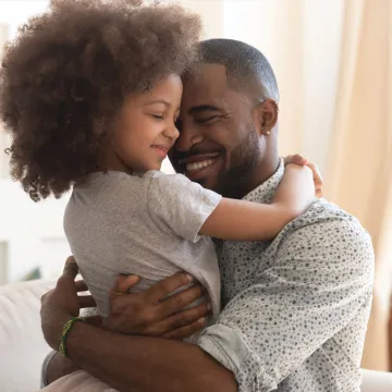 Daughter hugging her dad