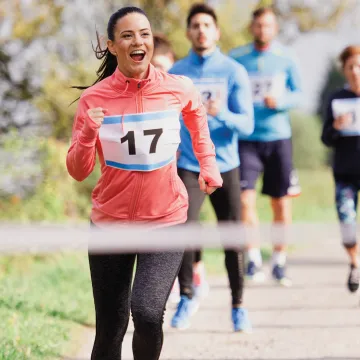 Runners approaching the finish line of a race