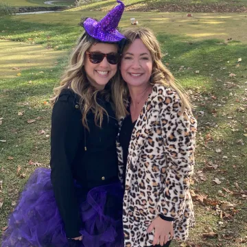 Two women dressed up for Halloween on a golf course