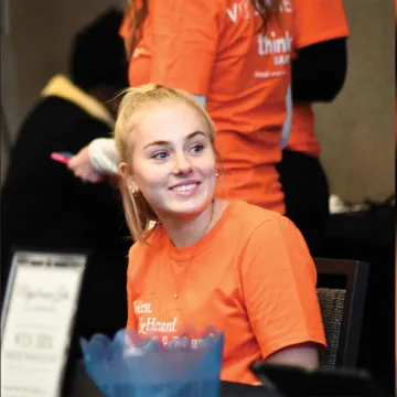 Woman smiling at event registration